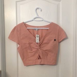 pink cropped shirt